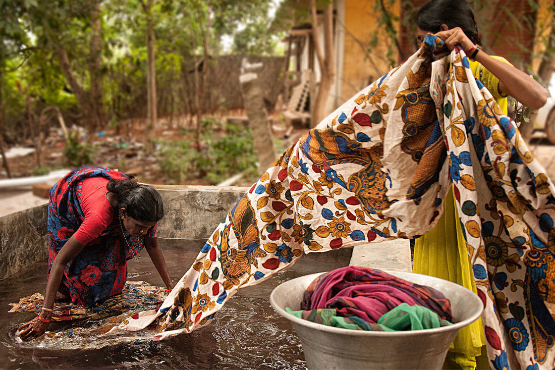 Traditional Kalamkari saree making process showing charcoal sketching, bamboo pen outlining, and natural dyeing techniques in South India